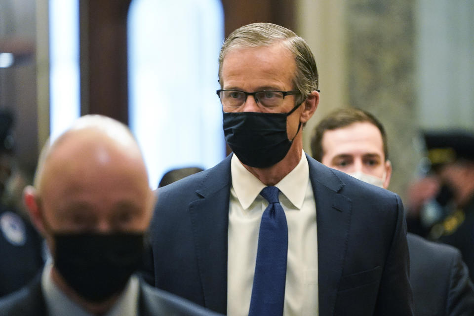 Sen. John Thune, R-S.D., arrives prior to the start of arguments in the second impeachment trial of former President Donald Trump, at the Capitol, Wednesday, Feb. 10, 2021 in Washington. (Joshua Roberts/Pool via AP)