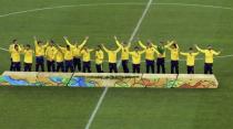 2016 Rio Olympics - Soccer - Victory Ceremony - Men's Football Tournament Victory Ceremony - Maracana - Rio de Janeiro, Brazil - 20/08/2016. Brazilian players stand moments before the medal ceremony. REUTERS/Murad Sezer