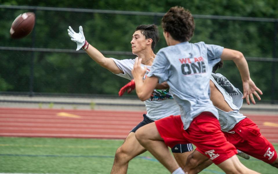 Franklin High School reciever Luke Trinanes stretches out against Holliston in Tuesday's evening's  seven on seven Friendship League at Ashland High School, July 18, 2023.  Twelve area schools are taking part in the annual summer passing league.