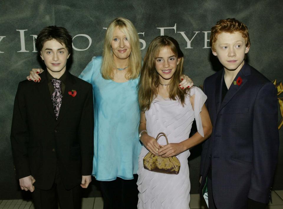 Daniel Radcliffe, author J.K. Rowling, actress Emma Watson and actor Rupert Grint attend the world premiere of 'Harry Potter and the Chamber of Secrets' at the Odeon Leicester Square on November 3, 2002 in London, England. Daniel Radcliffe plays the role of child wizard Harry Potter in the movie. Emma Watson stars as Hermione Granger and Rupert Grint stars as Ron Weasley in the film. (Photo by Dave Hogan/Getty Images)