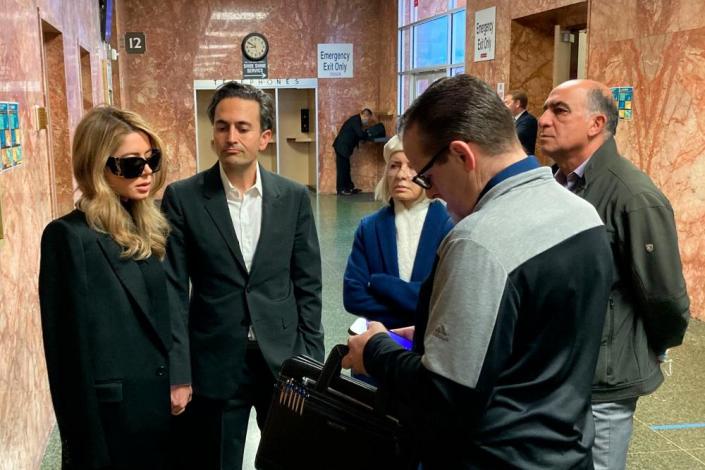 Khazar Elyassnia, left, stands in the Hall of Justice in San Francisco on 14 April, ahead of an appearance by her brother, Nima Momeni, who has been charged with murder in the death of tech entrepreneur Bob Lee.
