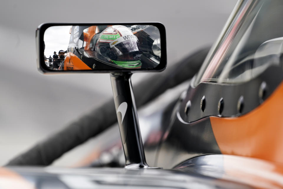 Pato O'Ward, of Mexico, sits in his car during testing at the Indianapolis Motor Speedway, Thursday, April 8, 2021, in Indianapolis. (AP Photo/Darron Cummings)