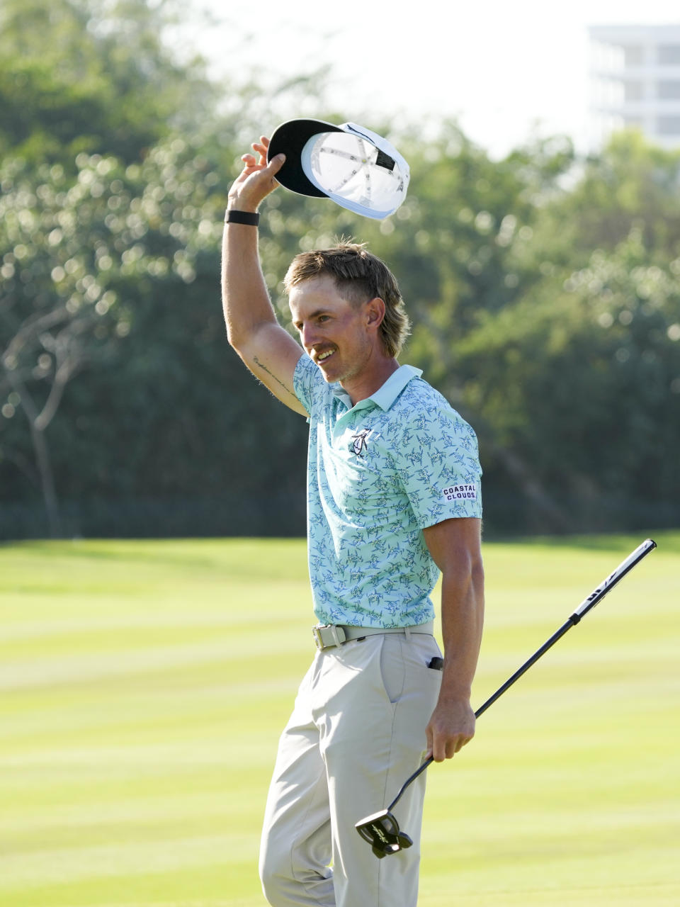 Jake Knapp, of the United States celebrates on the 18th green after winning the Mexico Open golf tournament in Puerto Vallarta, Mexico, Sunday, Feb. 25, 2024. (AP Photo/Fernando Llano)