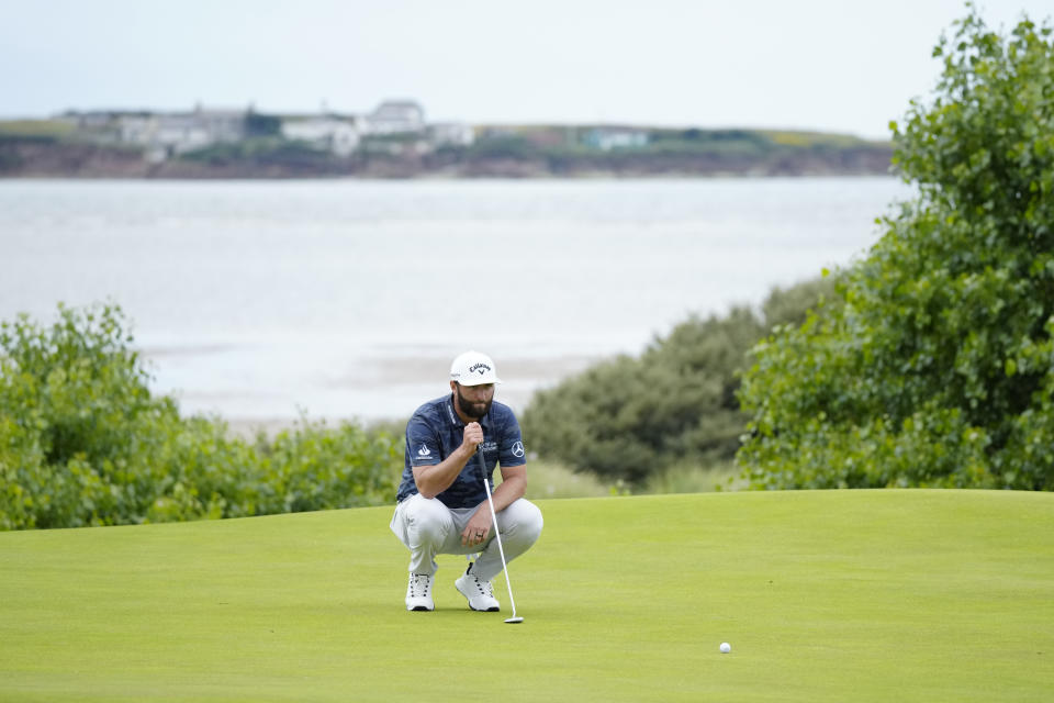 Spain's Jon Rahm looks at his putt on the 17th green during the third day of the British Open Golf Championships at the Royal Liverpool Golf Club in Hoylake, England, Saturday, July 22, 2023. (AP Photo/Jon Super)