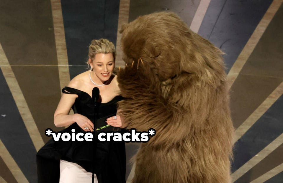 Elizabeth Banks presenting at the Oscars with a bear