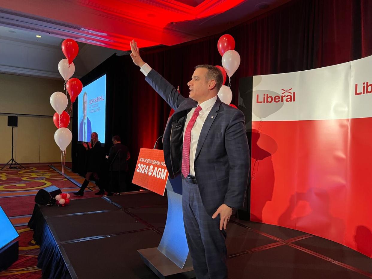 Liberal Leader Zach Churchill addresses a crowd of around 200 Friday evening at the party's annual general meeting. (Jean Laroche/CBC - image credit)