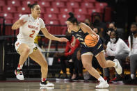 Mount St. Mary's guard Kendall Bresee (3) drives to the basket against Maryland forward Mimi Collins (2) during the first half of an NCAA college basketball game Tuesday, Nov. 16, 2021, in College Park, Md. (AP Photo/Nick Wass)