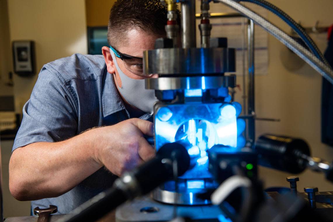 Robert Seffens, a technologist at PNNL, performs mechanical testing of polymers such as rubber in low-pressure hydrogen to help evaluate the feasibility of using the existing natural gas pipeline infrastructure to transport hydrogen as a sustainable energy solution. 