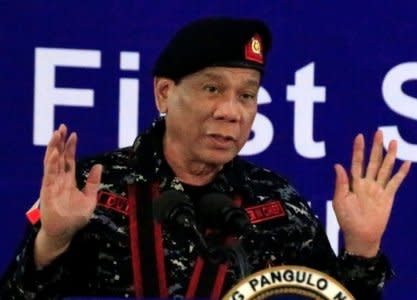 FILE PHOTO: Philippine President Rodrigo Duterte, wearing a military uniform, gestures as he delivers a speech during the 67th founding anniversary of the First Scout Ranger regiment in San Miguel town, Bulacan province, north of Manila, Philippines November 24, 2017. REUTERS/Romeo Ranoco