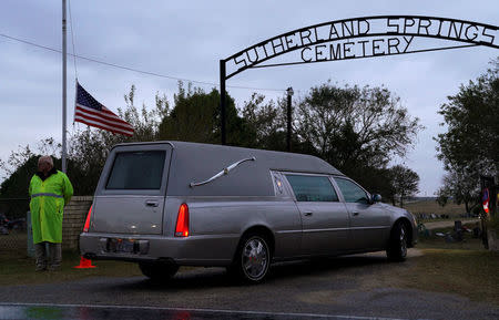 One of two hearses arrives at the cemetery for the burial of Richard and Therese Rodriguez after the husband and wife were killed in the shooting at First Baptist Church of Sutherland Springs in Texas, U.S., November 11, 2017. REUTERS/Rick Wilking