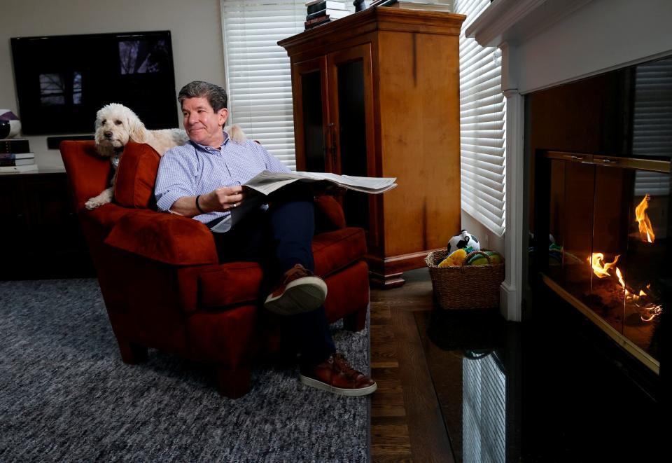 Former Detroit Free Press editorial page editor Brian Dickerson with his dog Lola at his Birmingham on Jan. 20, 2023. Dickerson was one of eight Free Press journalists that took a buyout and saved the jobs of others in the newsroom.  He was with the newspaper for 35 years.