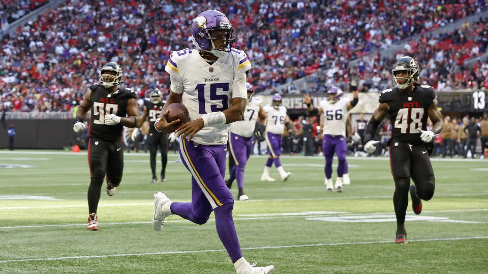 Dobbs runs the ball in for a touchdown during the third quarter of the game against the Falcons. - Alex Slitz/Getty Images