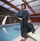 <p>The singer—and sex symbol—Tom Jones stands next to his swimming pool in a robe at his home in the U.K. </p>