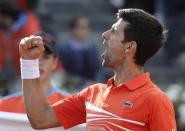 Novak Djokovic, of Serbia reacts after winning the second set against Rafael Nadal of Spain during their final match at the Italian Open tennis tournament, in Rome, Sunday, May 19, 2019. (AP Photo/Gregorio Borgia)