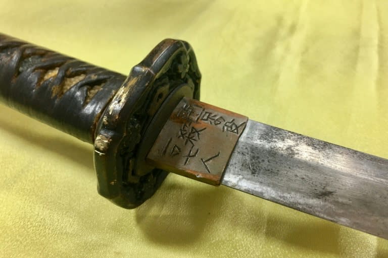 A Japanese samurai sword with Chinese script that reads "killed 107 people during the war in Nanjing, (China)", and was used August 18 by an attacker who slashed a military police guard at the Presidential Palace, at a local police station in Taipei