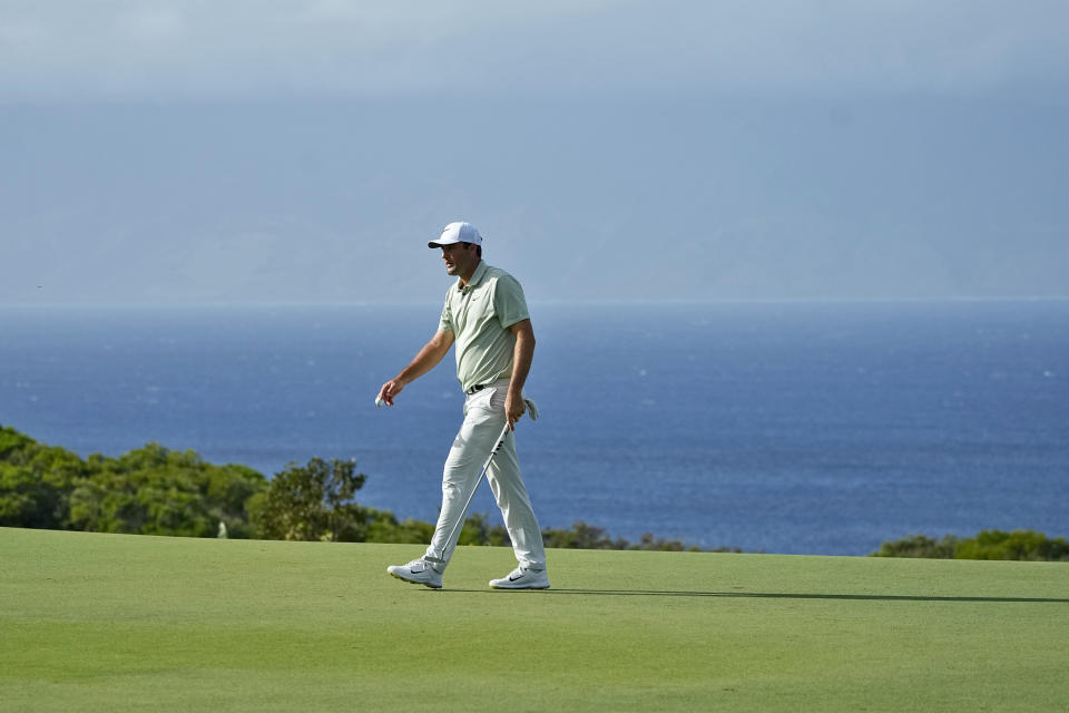 Scottie Scheffler walks off the 14th green during the first round of The Sentry golf event, Thursday, Jan. 4, 2024, at Kapalua Plantation Course in Kapalua, Hawaii. (AP Photo/Matt York)