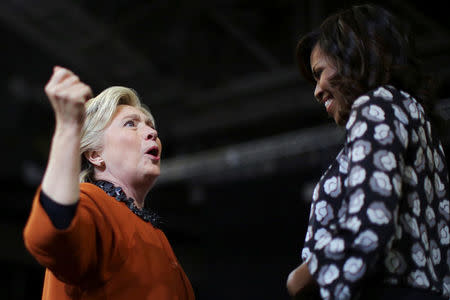 U.S. Democratic presidential candidate Hillary Clinton reacts as she introduces U.S. first lady Michelle Obama during a campaign rally in Winston-Salem, North Carolina, U.S., October 27, 2016. REUTERS/Carlos Barria