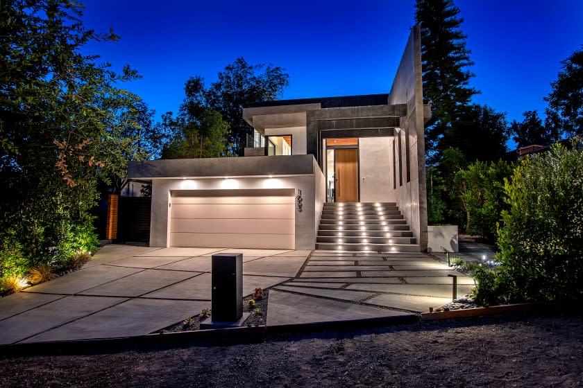 The newly built Silver Lake home, listed for $3.599 million, stands out from the street with its subdued hues, clean lines and modern arcade that tops the entry. Inside, the open-concept floor plan turns the page with French oak floors and white walls that brighten the interior. Leathered quartz countertops create visual interest in the kitchen, which has an island and bi-folding doors that open to the patio. Outside, there's a swimming pool and spa. A rooftop deck creates an additional 1,500 square feet of living space above.