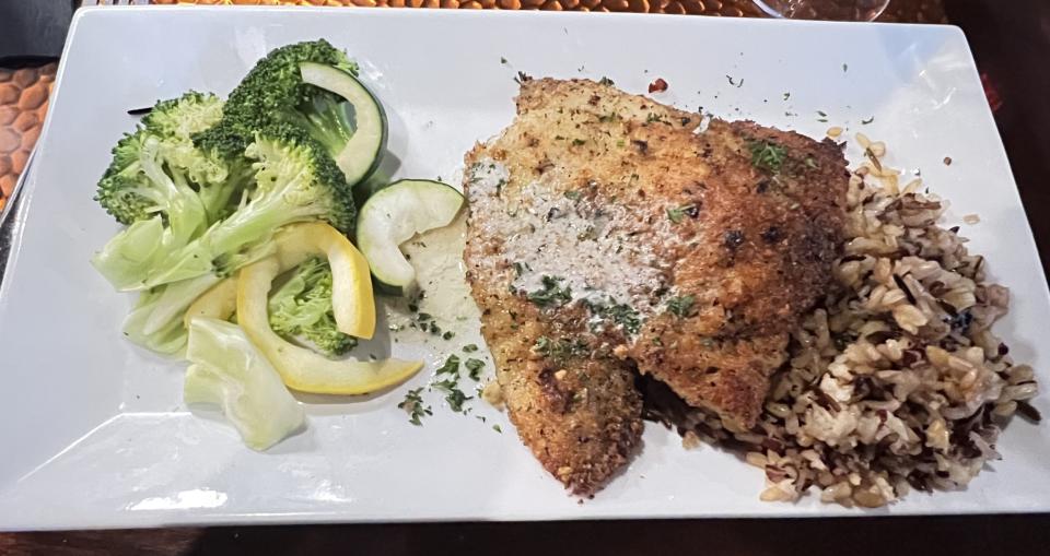 At Fin & Flame Grill and Oyster Bar in Palm City, the pistachio crusted black grouper was an appetizing dish topped with vanilla and Key lime butter and served on nutty wild rice.