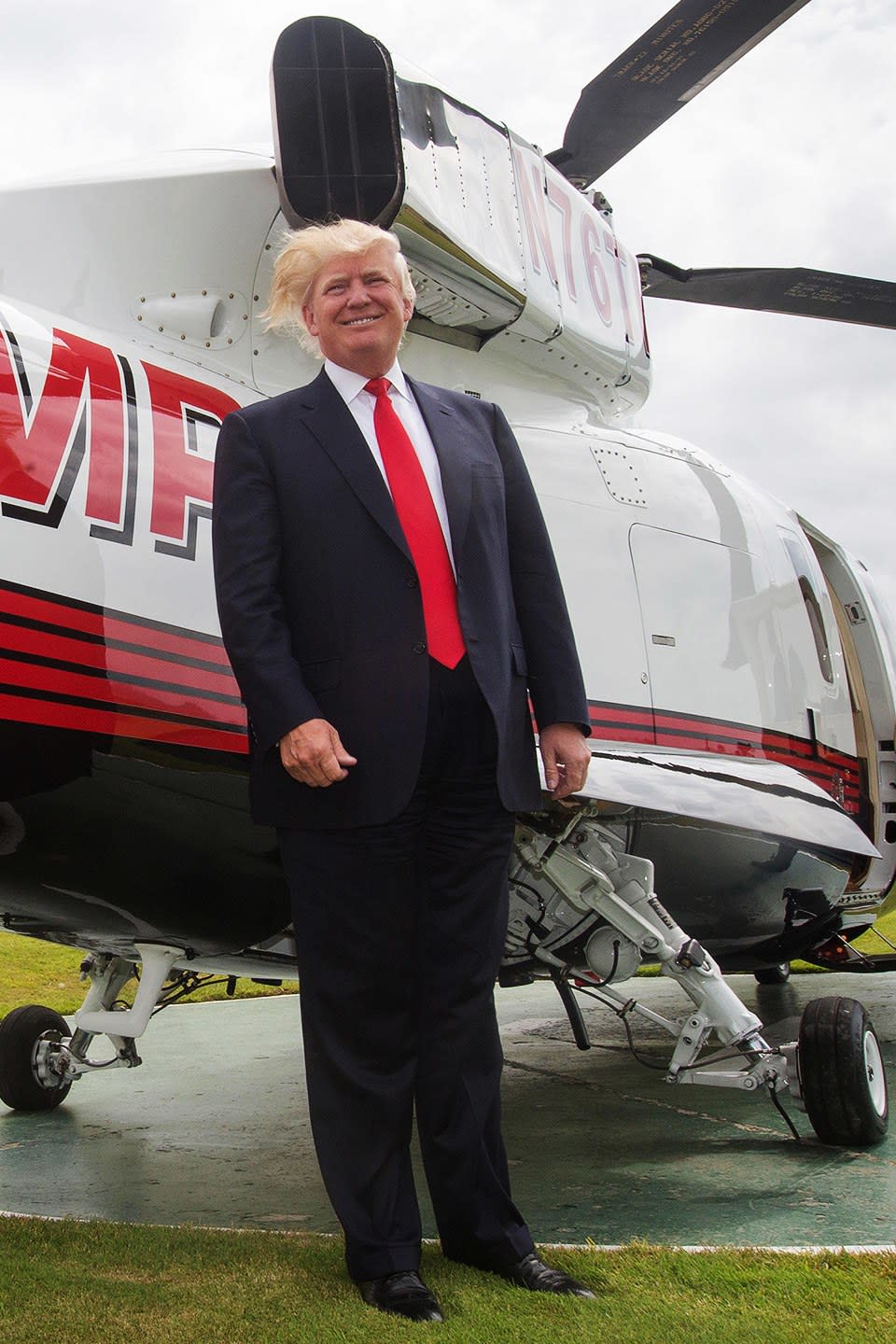 Losing to wind next to his helicopter in Scotland.