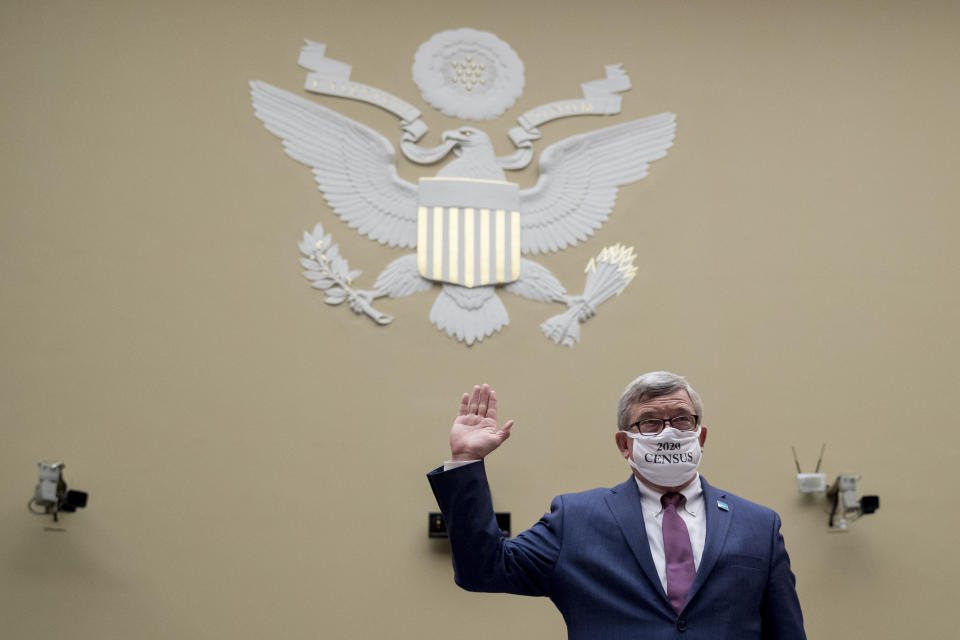 Census Bureau Director Steven Dillingham wears a mask with the words "2020 Census" as he is sworn in to testify before a House Committee on Oversight and Reform hearing on the 2020 Census​ on Capitol Hill, Wednesday, July 29, 2020, in Washington. (AP Photo/Andrew Harnik)