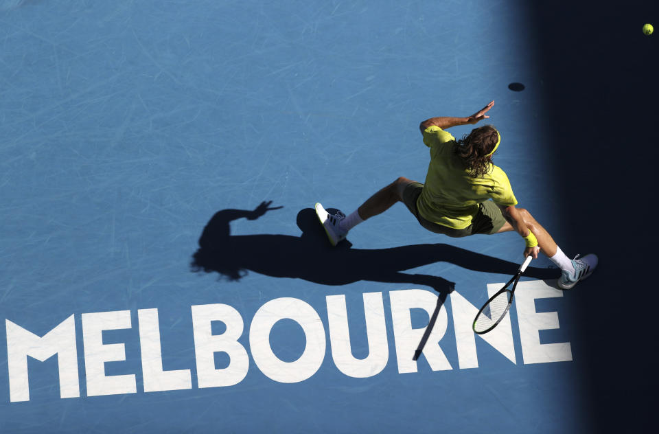 Greece's Stefanos Tsitsipas hits a forehand to Sweden's Mikael Ymer during their third round match at the Australian Open tennis championships in Melbourne, Australia, Saturday, Feb. 13, 2021. (AP Photo/Hamish Blair)