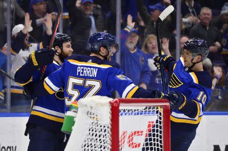 Mar 19, 2019; St. Louis, MO, USA; St. Louis Blues left wing David Perron (57) celebrates with center Ryan O'Reilly (90) and center Brayden Schenn (10) after scoring his second goal of the game during the third period against the Edmonton Oilers at Enterprise Center. Mandatory Credit: Jeff Curry-USA TODAY Sports