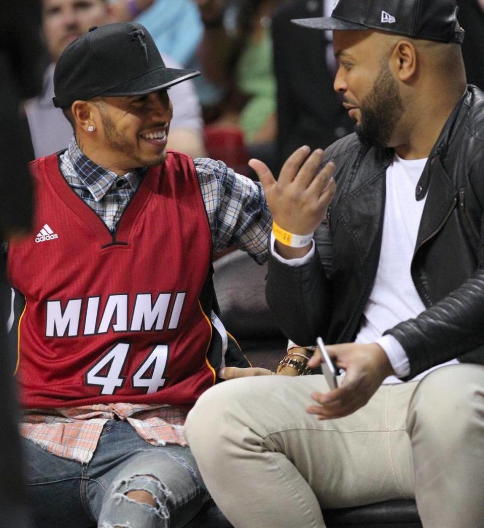 British Formula One racing driver Lewis Hamilton wearing Heat jersey with his car No. 44 during a Miami Heat game at AmericanAirlines Arena on New Year’s Day, 2016. The only Black driver in F1 history has won the World Championship seven times, tying Germany’s Michael Schumacher for the most ever, and holds the career records for wins and pole positions.