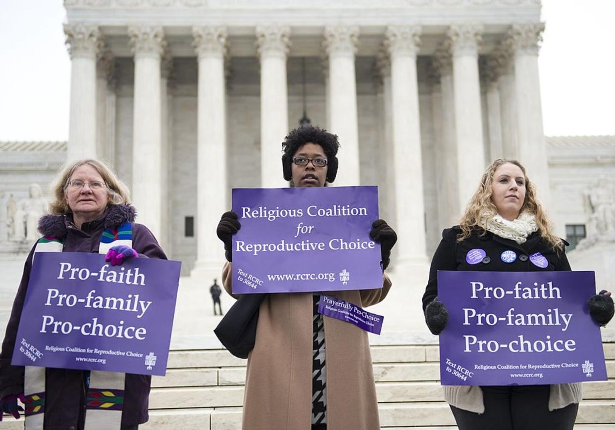 <span class="caption">Demonstrators stand outside the Supreme Court in 2014.</span> <span class="attribution"><a class="link " href="https://www.gettyimages.com/detail/news-photo/pro-choice-demonstrators-stand-outside-the-us-supreme-court-news-photo/462793499?adppopup=true" rel="nofollow noopener" target="_blank" data-ylk="slk:Saul Loeb/AFP via Getty Images;elm:context_link;itc:0;sec:content-canvas">Saul Loeb/AFP via Getty Images</a></span>