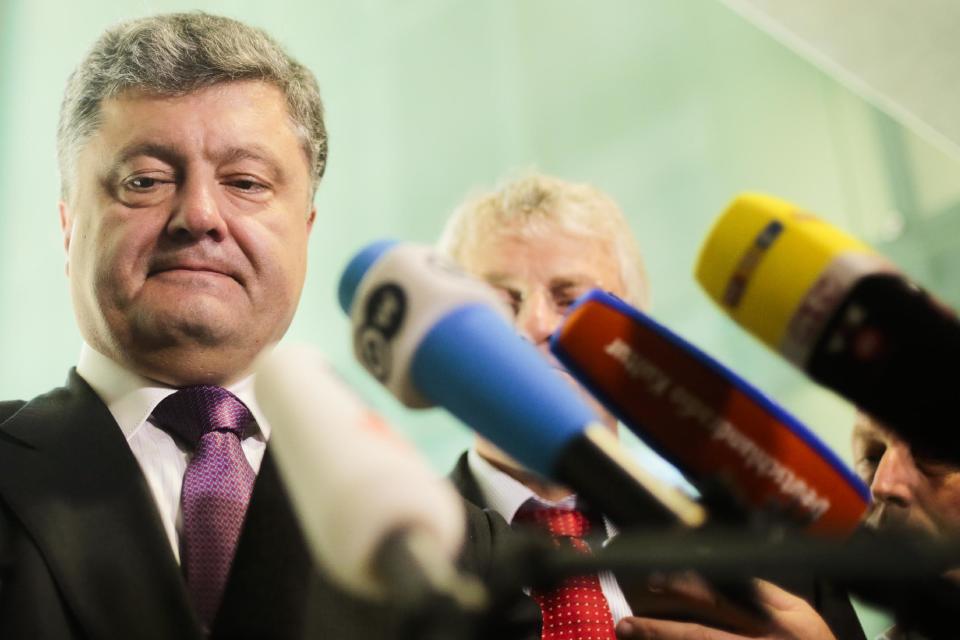 Ukrainian presidential candidate and businessman Petro Poroshenko briefs the media after a meeting with Germany's Christian Union's faction law makers in Berlin, Germany, Wednesday, May 7, 2014. The Ukrainian government is planing a presidential election on May 25, 2014. (AP Photo/Markus Schreiber)