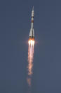 In this image provided by NASA, the Soyuz MS-18 rocket is launched with NASA astronaut Mark Vande Hei, Roscosmos cosmonauts Pyotr Dubrov and Oleg Novitskiy, Friday, April 9, 2021, at the Baikonur Cosmodrome in Kazakhstan. The Russian-U.S. trio of space travelers launched successfully Friday, heading for the International Space Station.(Bill Ingalls/NASA via AP)