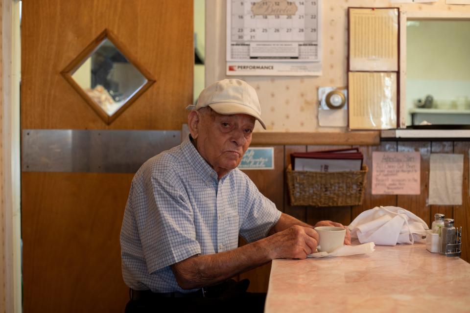 Angelo Rallis sits at the counter for a cup of coffee before the lunch rush, pictured on Tuesday, Oct. 11, 2022.