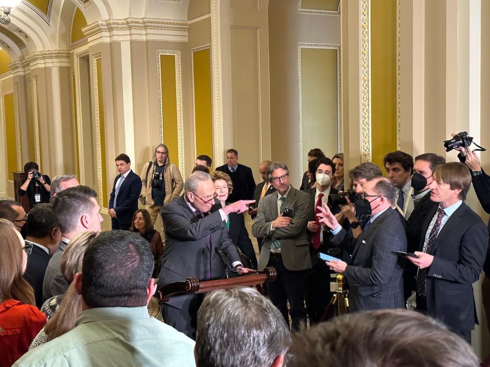 Senate Majority Leader Chuck Schumer calling on a reporter at a press conference in December.