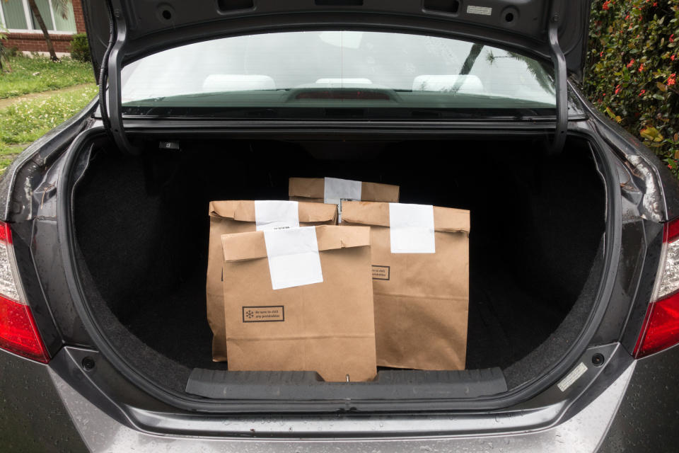 grocery bags in trunk of car