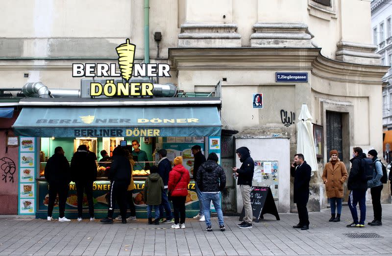 People queue at a takeaway restaurant during the second lockdown as the coronavirus disease (COVID-19) outbreak continues in Vienna