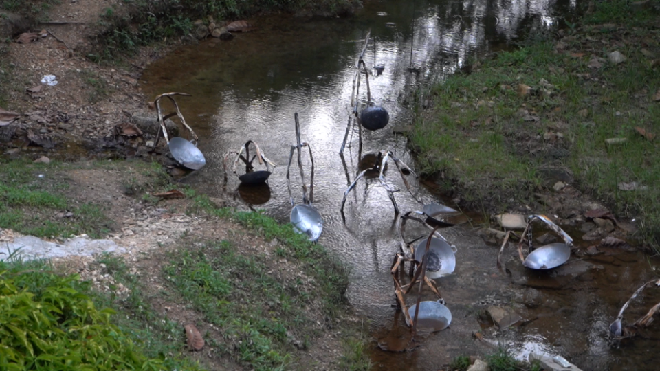 David Wong's ‘Dulang’ features washing pans in a stream to highlight Kuala Lumpur’s tin mining history. — Picture by Ahmad Zamzahuri