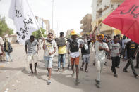 Anti-military protesters march on Friday, July 1, 2022 in Khartoum, Sudan, a day after nine people were killed in demonstrations against the country’s ruling generals. (AP Photo/Marwan Ali)