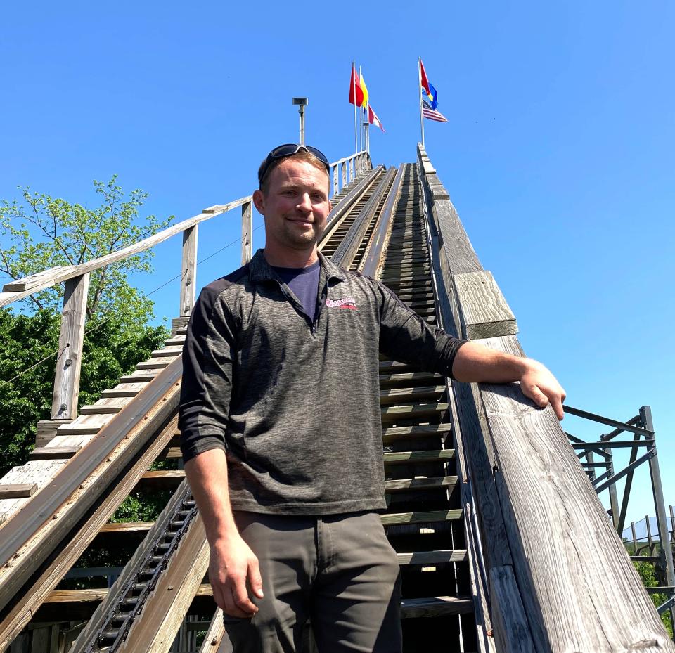 Jacob Griffith, 37, a ride mechanic at Waldameer Park & Water World, stands May 23 on the initial incline of his favorite ride, the Ravine Flyer II. He helped assemble the ride before it opened in 2008.