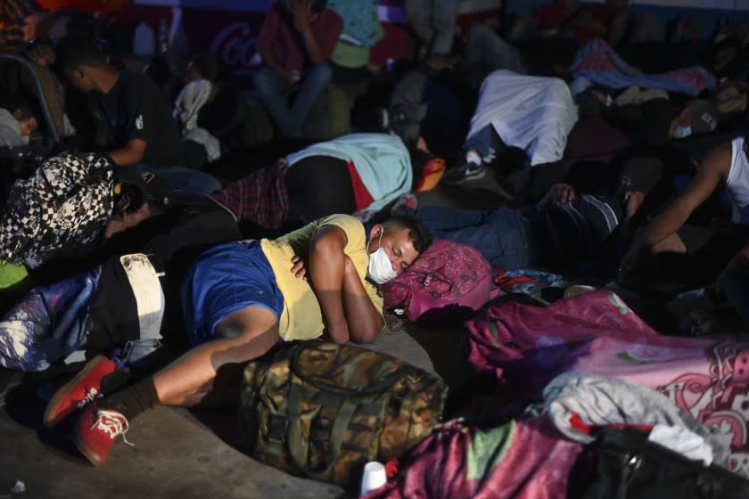 Honduran migrants, part of a caravan heading to the US, rest in Entre Rios, Guatemala, after they crossed the border from Honduras on October 1, 2020. - Thousands of mostly Honduran migrants bound for the United States surged across the border into Guatemala on Thursday, just weeks before a tense American presidential election where immigration is a key issue. (Photo by Johan ORDONEZ / AFP) (Photo by JOHAN ORDONEZ/AFP via Getty Images)