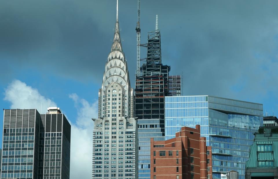 The Chrysler Building stands next to One Vanderbilt on September 18, 2019 as it tops out at 1,401 feet, and becomes the tallest office building in Midtown, New York. - The building is designed by Kohn Pedersen Fox, and the tower is now Midtowns tallest office building and the fourth-tallest skyscraper in New York City. (Photo by TIMOTHY A. CLARY / AFP)        (Photo credit should read TIMOTHY A. CLARY/AFP via Getty Images)