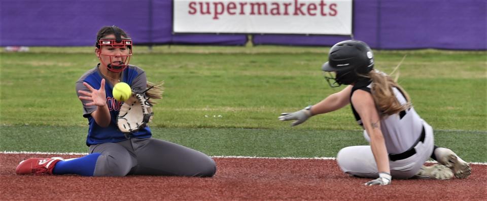 Cooper second baseman Nadia Garcia fields the throw from catcher Gabby De Leon as Wylie's Jadyn Fernandez tries to steal second in the first inning. Fernandez was safe on the play.