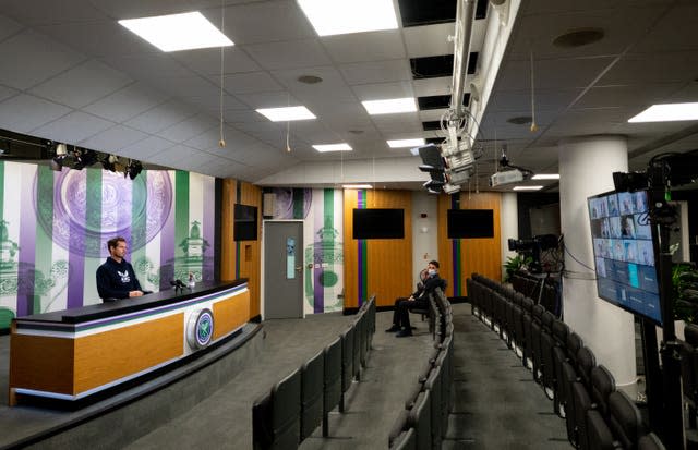 Andy Murray sits in an empty media room, with all press conferences being conducted virtually