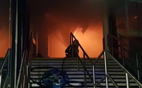 Firefighters tackle the blaze inside Nottingham station - Credit: Nottinghamshire Fire and Rescue Service 