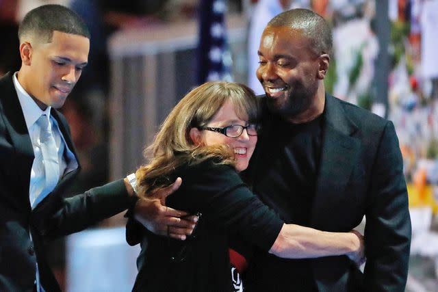 <p>Aaron P. Bernstein/Getty</p> Christine Leinonen, mother of Christopher 'Dru' Leinonen, is comforted by Brandon Wolf (L), survivor of the attack at the Pulse nightclub in Orlando, and Film and Television Producer Lee Daniels (R) as they walk off stage during the third day of the Democratic National Convention at the Wells Fargo Center, July 27, 2016, in Philadelphia