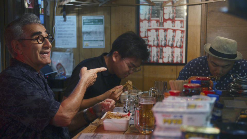 This image released by Apple TV+ shows actor Eugene Levy, left, in a scene from his new travel series “The Reluctant Traveler,” premiering Feb. 24. (Apple TV+ via AP)