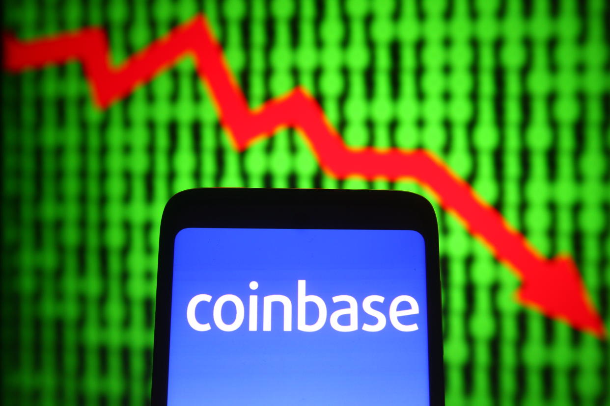 Coinbase logo of a cryptocurrency company is seen on a smartphone screen. 