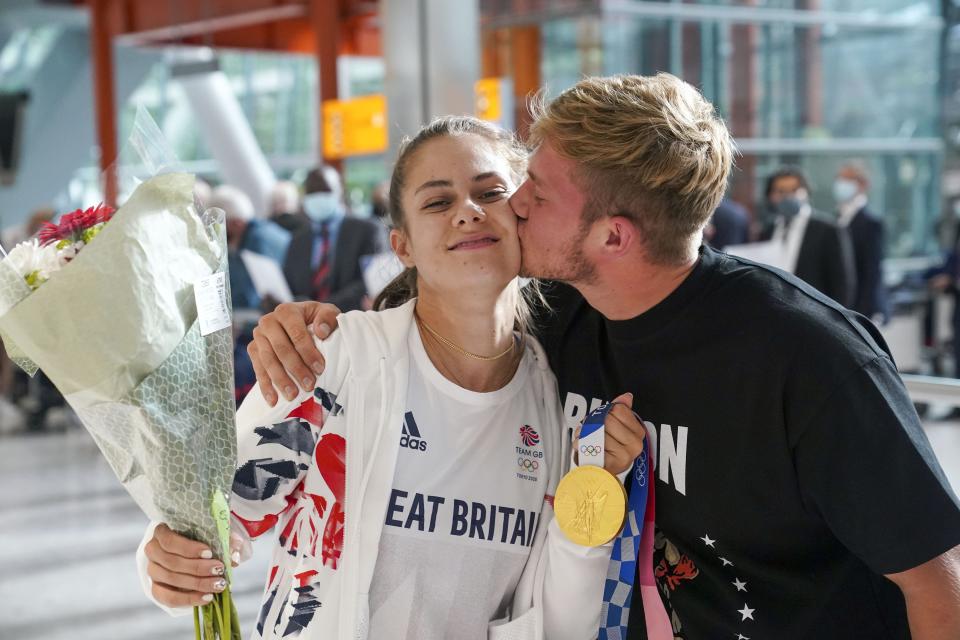 Gold medal winning BMX rider Bethany Shriever is met by her boyfriend Brynley Savage on her return to the UK (Steve Parsons/PA) (PA Wire)