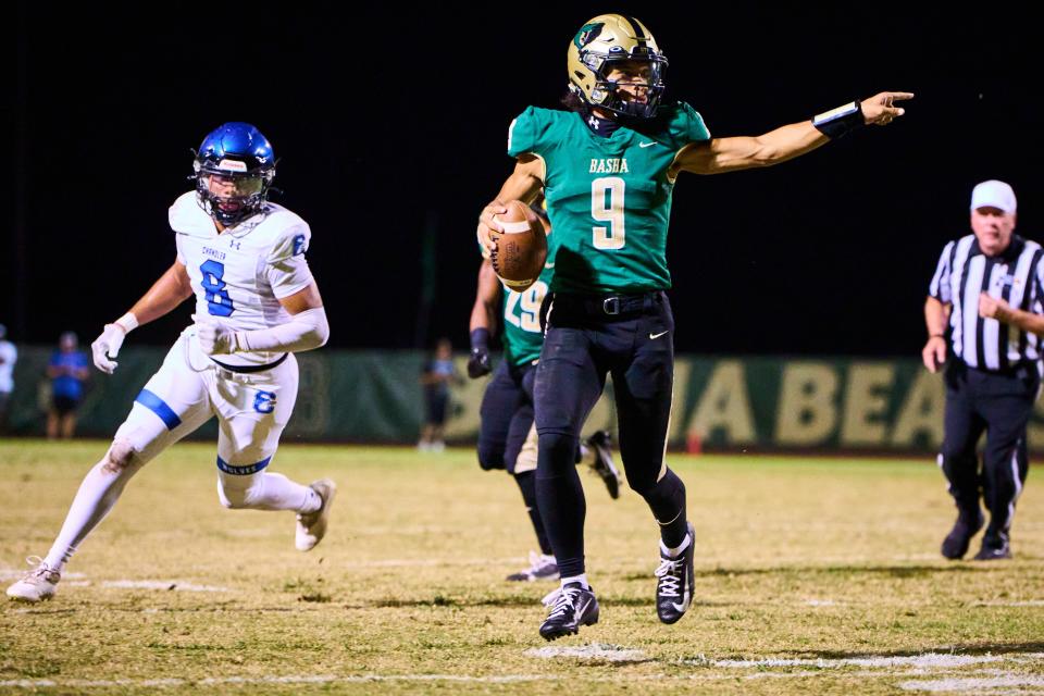 Basha Bears quarterback Demond Williams Jr. (9) looks to pass while being pursued by Chandler Wolves strong safety Cam Cooper (8) at Basha High School in Chandler on Friday, Oct. 20, 2023. Alex Gould/Special for The Republic