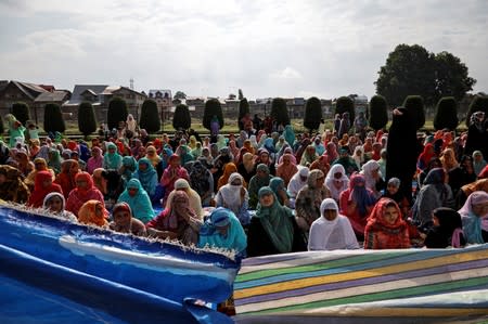 Kashmiri women offer Eid-al-Adha prayers at a mosque during restrictions after the scrapping of the special constitutional status for Kashmir by the Indian government, in Srinagar