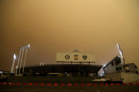 RingCentral Coliseum stands under skies darkened by wildfire smoke before the Oakland Athletics' baseball game against the Houston Astros in Oakland, Calif., Wednesday, Sept. 9, 2020. (AP Photo/Jed Jacobsohn)